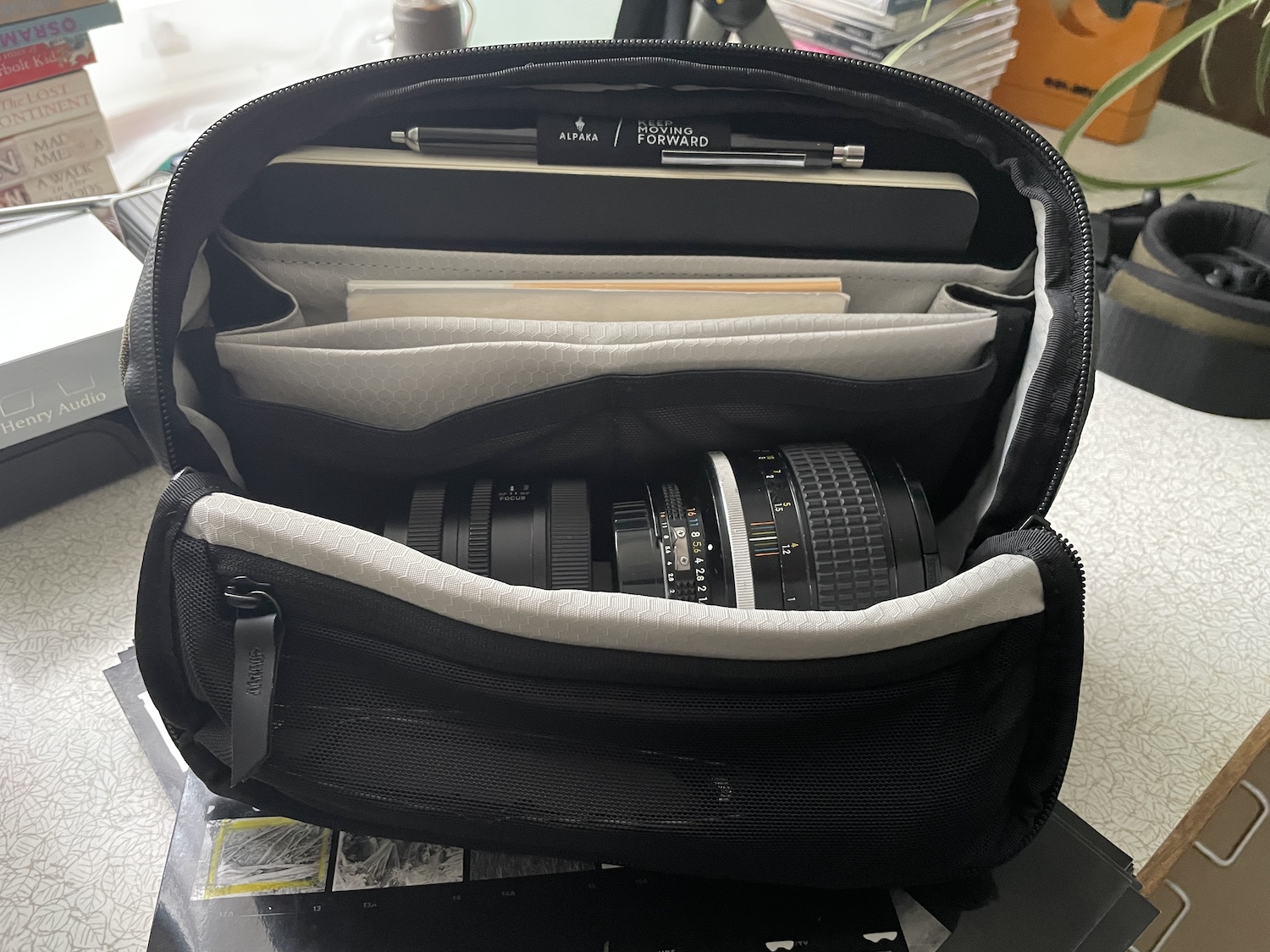 The Alpaka Vertex bag with a couple of lenses inside.