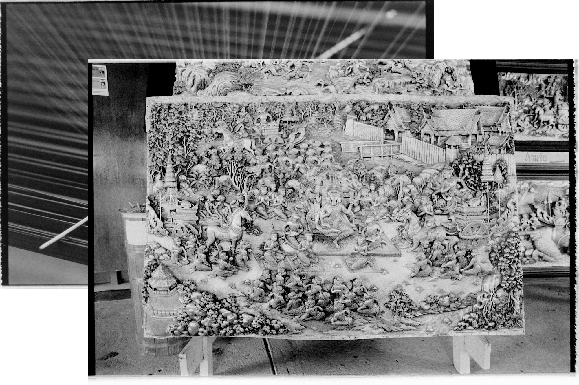 Silk in a loom and a large, beaten, silver panel.